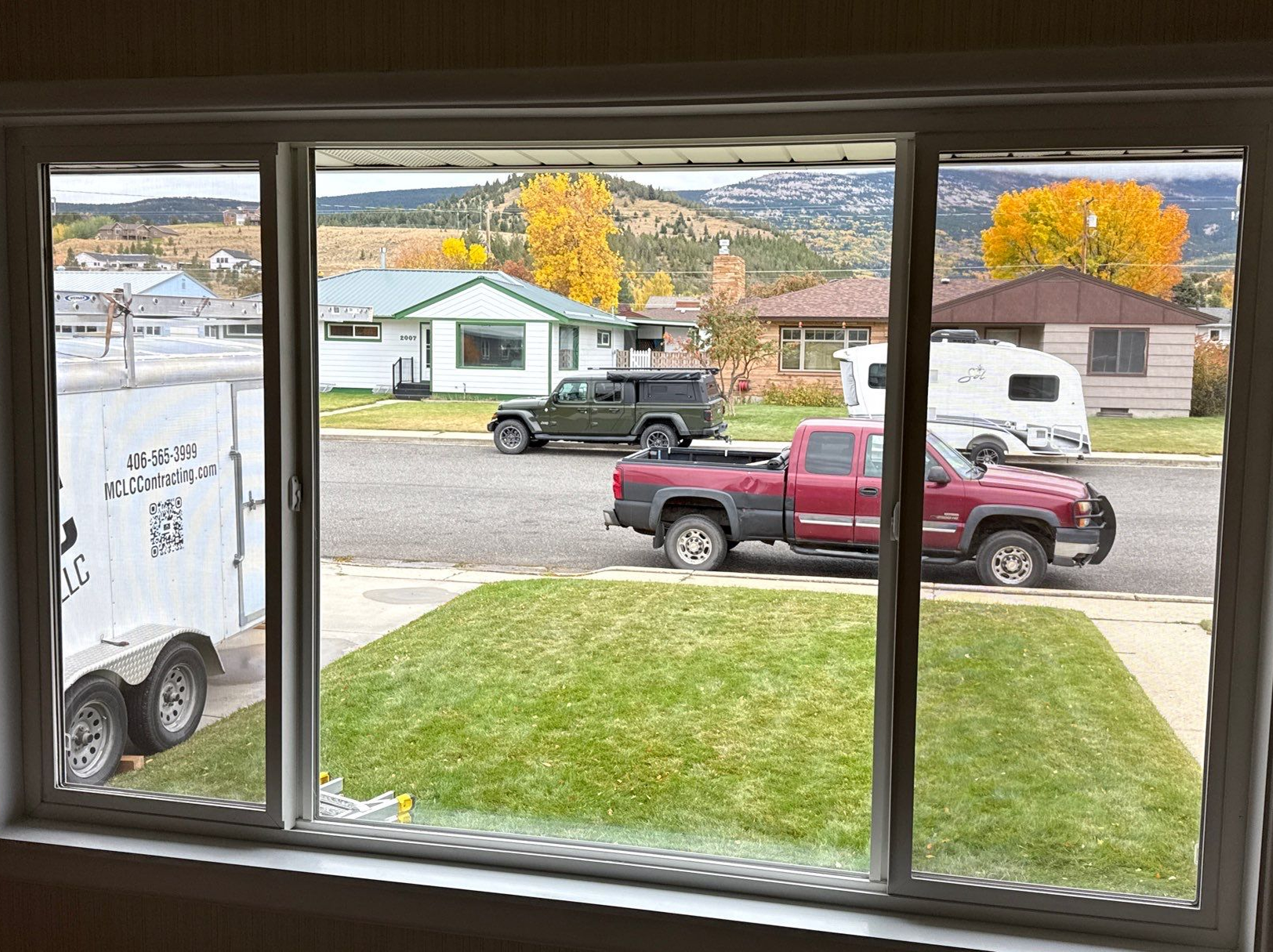 0ba47ce8-59ac-4a16-88ef-49462a897742 1 Modern black house exterior with well-maintained lawn and front steps.