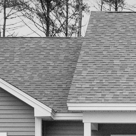 High-quality asphalt shingle roof installed by Example Co. in a residential property. Expert roofing.