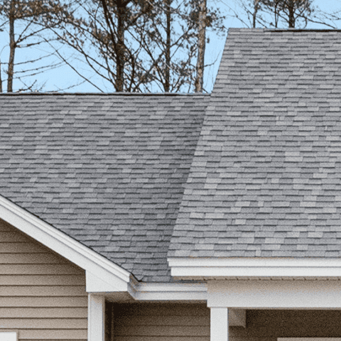 Close-up of a professionally installed asphalt shingle roof on a residential home.