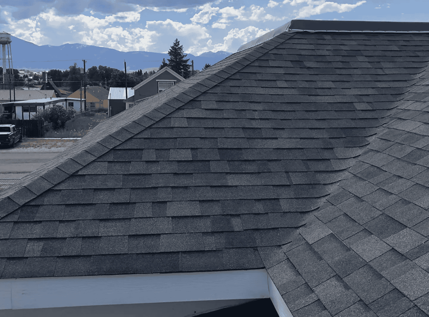 Roof Shingles Installation High-quality asphalt shingles on residential roof.