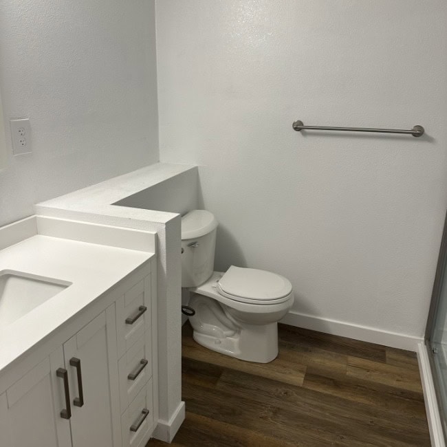 Modern Bathroom Setup Toilet and vanity in a clean, contemporary bathroom.
