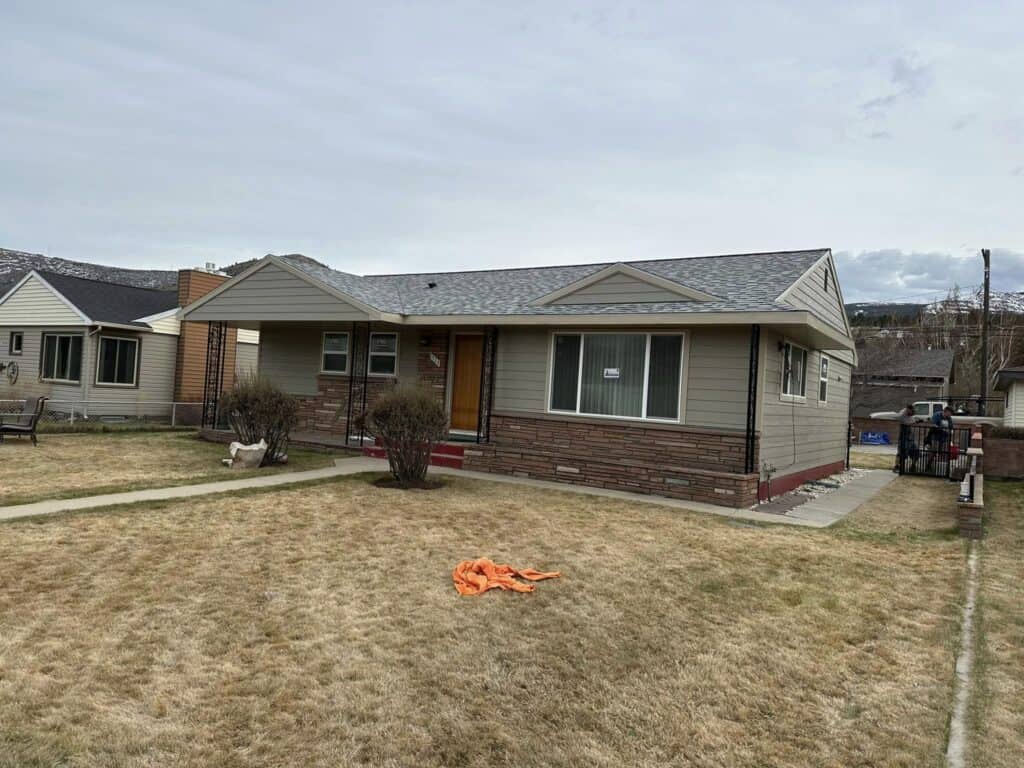 Home exterior with a well-maintained lawn and modern design. Perfect example of quality residential.