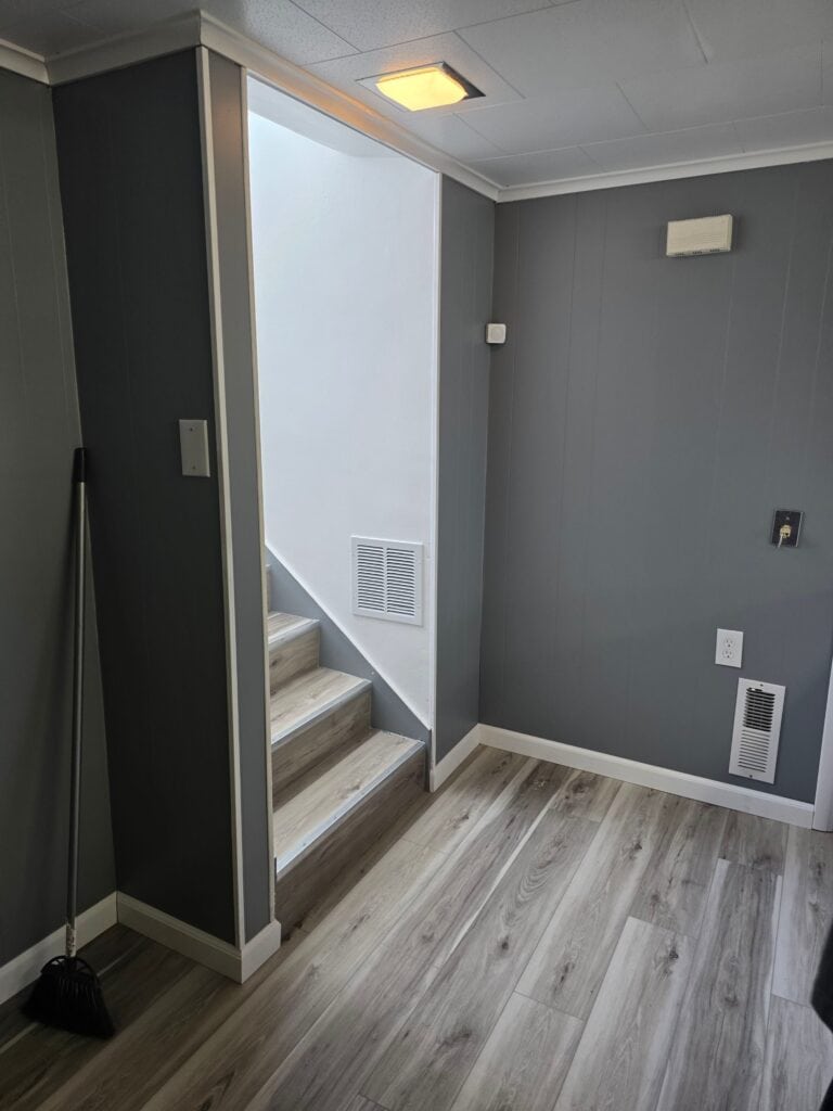 Modern Interior Staircase Interior view of a modern staircase with gray walls and wood flooring.