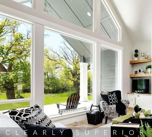 Bright sunroom with large windows and outdoor view.