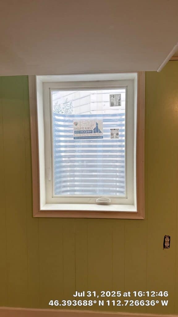 Modern Window Installation New energy-efficient window installed in a residential room with green walls.