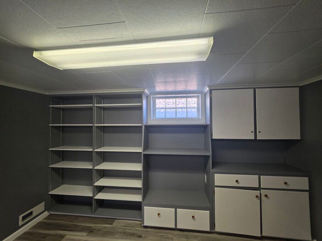 Storage Shelving Units Custom storage shelving units installed in a basement for organized storage solutions.