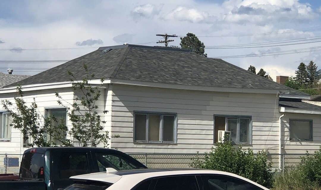 Residential house with new roofing and siding, showcasing quality home improvement services.