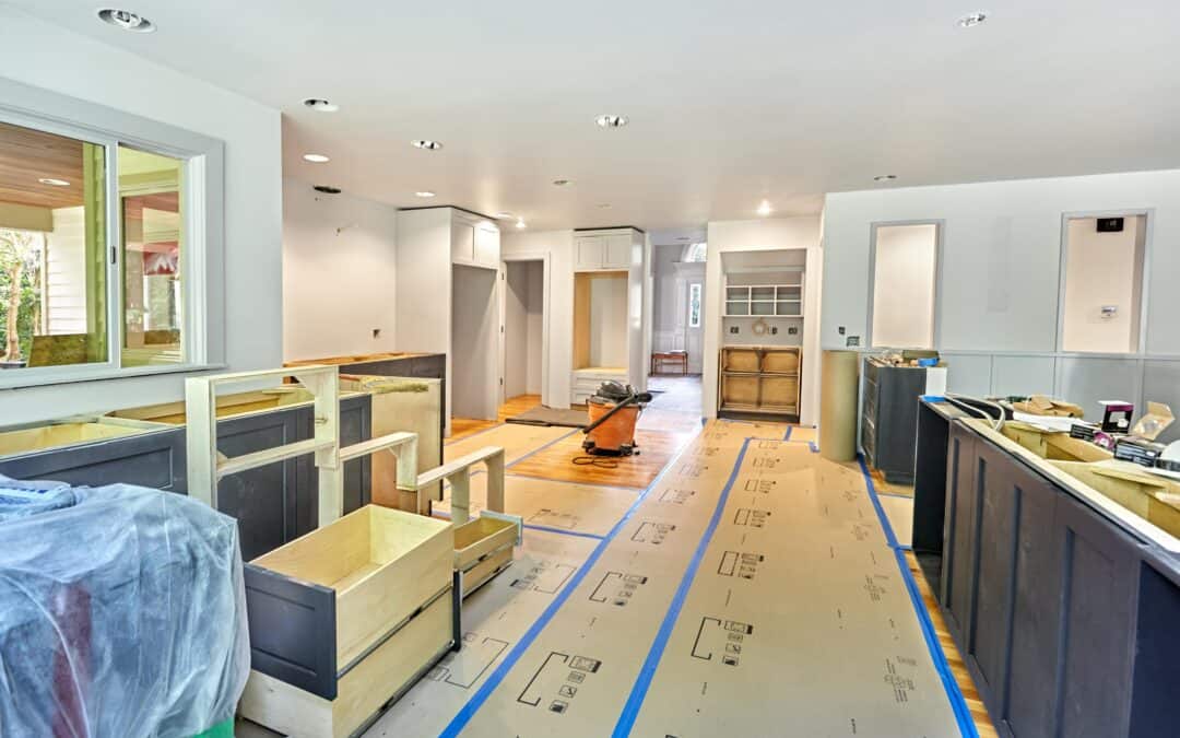 Interior of a house under renovation with construction materials and tools.