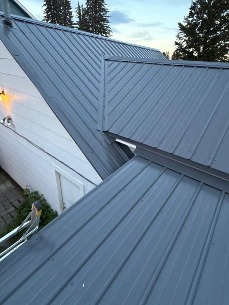 Close-up of a modern metal roof with multiple angles and panels.