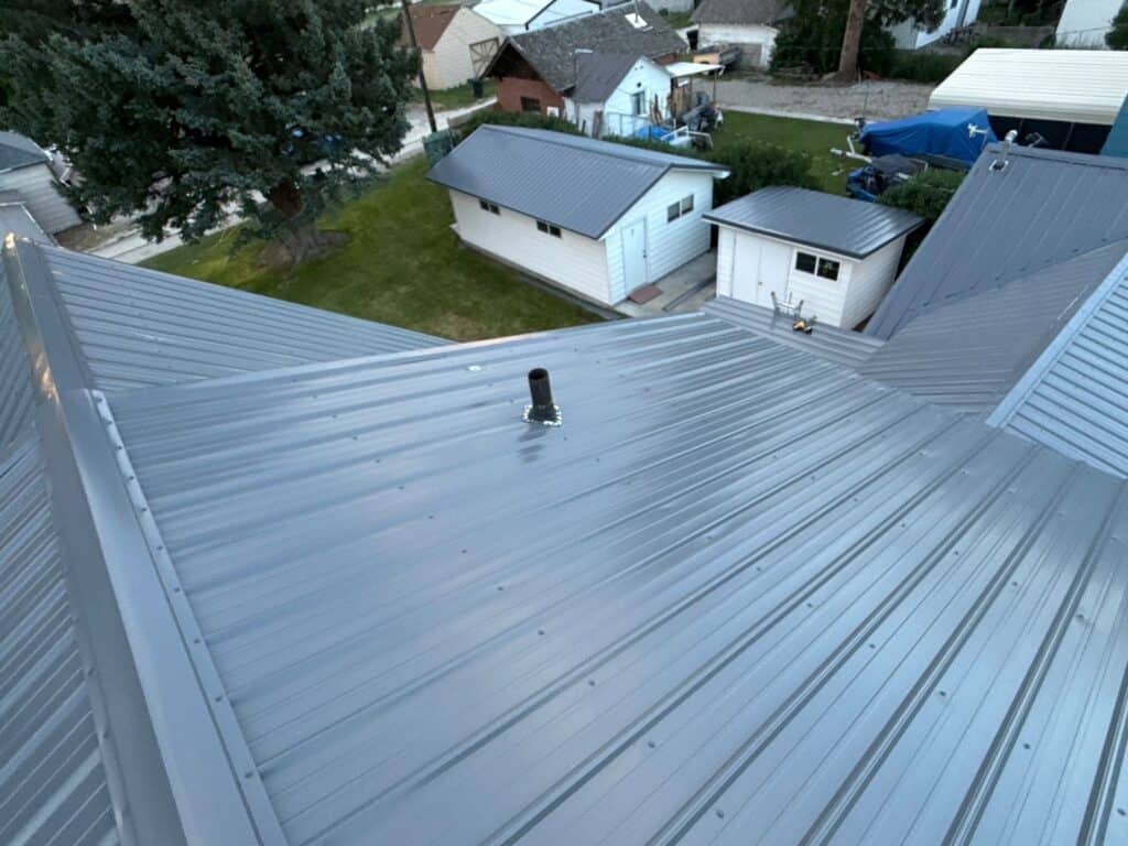 New metal roofing installed on residential property for durability and weather resistance.
